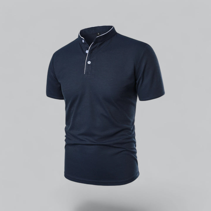 Man wearing a collarless polo shirt, exuding old money style & smart casual charm.
