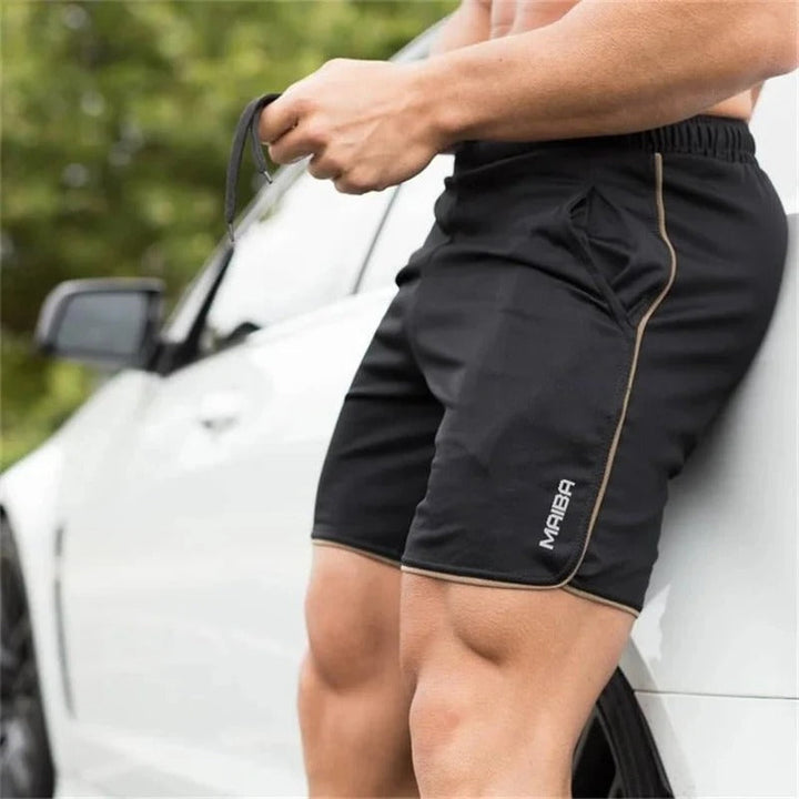 Detail shot of men's slim fit athletic shorts fabric. Performance activewear with drawstring for comfort & style.