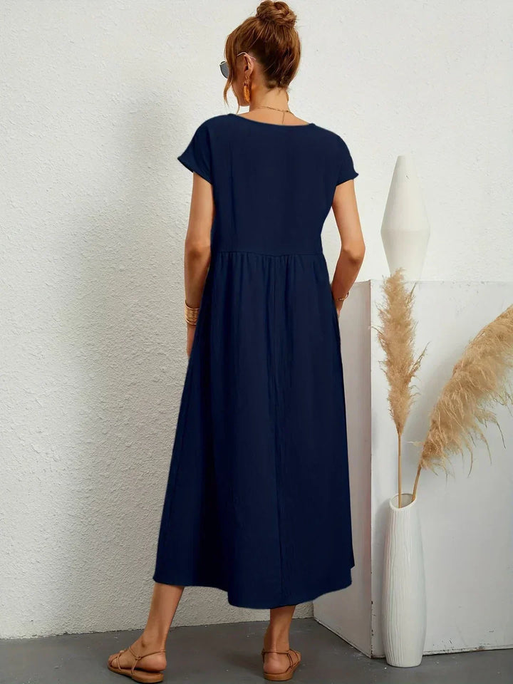 Chic and comfortable women's flowing midi dress, versatile for any wardrobe.
