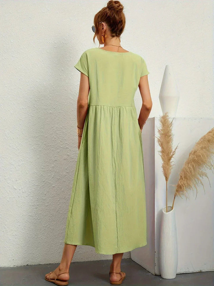 Timeless women's midi dress, an elegant flowing design offering superb comfort.