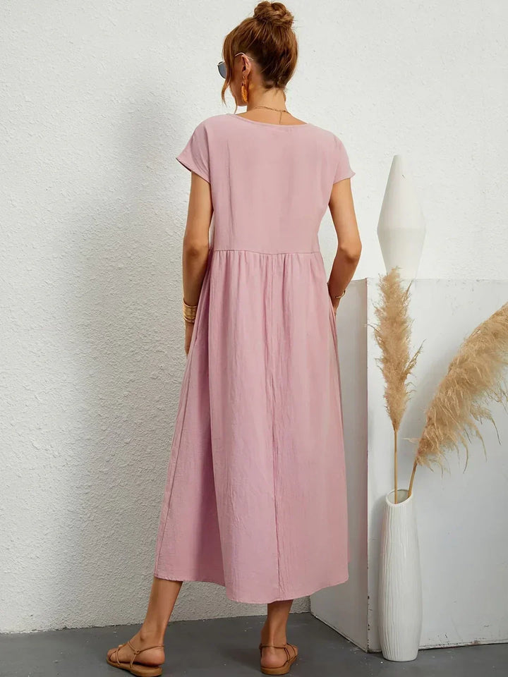 Timeless women's midi dress, comfortable and flowing, for sophisticated versatile wear.