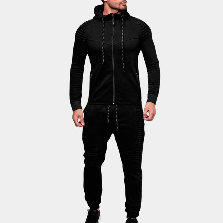 Athletic men's two-piece tracksuit for active lifestyle, featuring comfortable track pants and matching top.