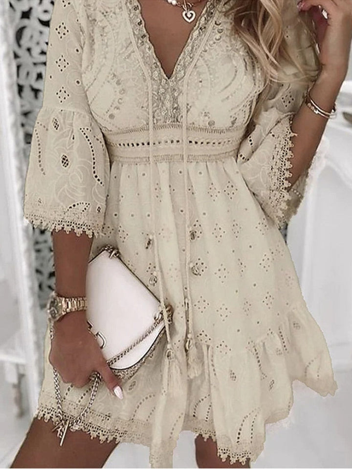 Chic women's half sleeve boho lace summer dress. A comfortable, flowy design for stylish casual or beach wear.