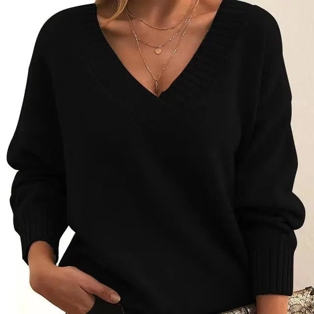 Stylish women's round neck knit sweater. Soft long-sleeve pullover, perfect for elegant winter fashion & warmth.