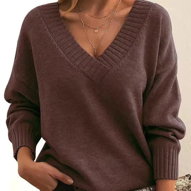 Cozy women's elegant knit sweater. Soft long-sleeve pullover for classic winter style & everyday comfort.