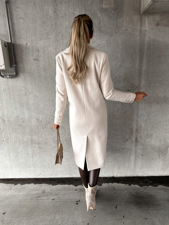 Luxurious women's warm winter coat, elegant double-breasted design for stylish cold weather fashion.