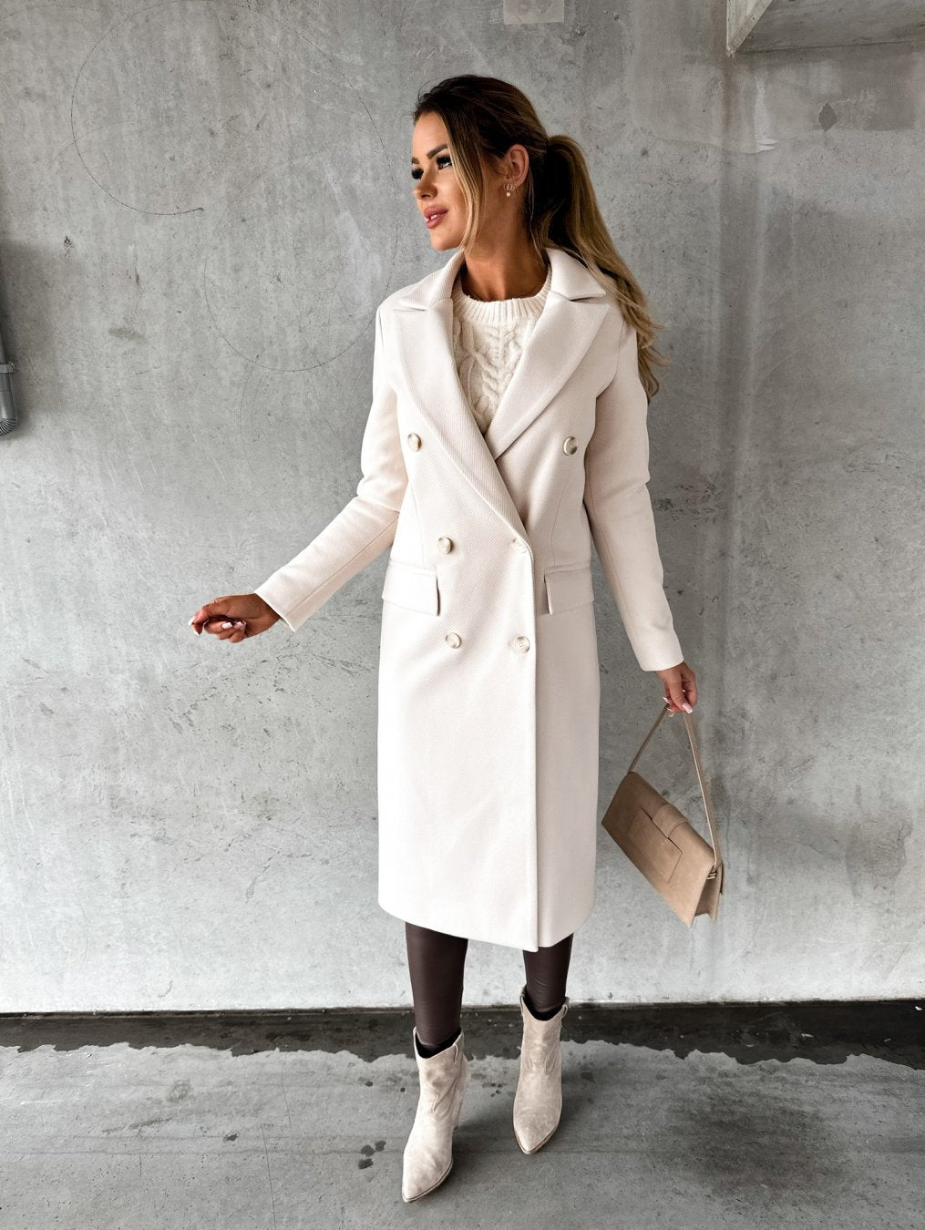 Stylish women's double-breasted winter jacket, elegant outerwear for fashion-conscious cold weather days.