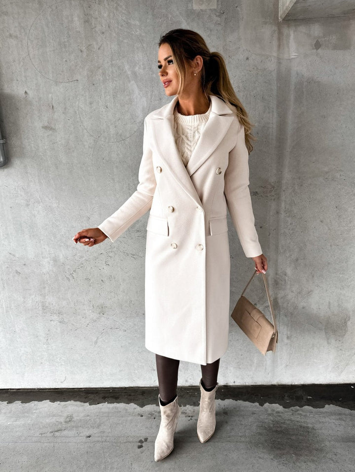 Stylish women's double-breasted winter jacket, elegant outerwear for fashion-conscious cold weather days.