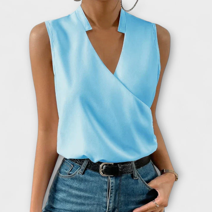 Comfortable women's V-neck top, ideal for warm weather and chic casual or elegant outfits.