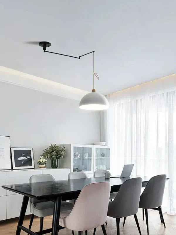 Contemporary overhead light with flexible arms for versatile home lighting and task illumination.
