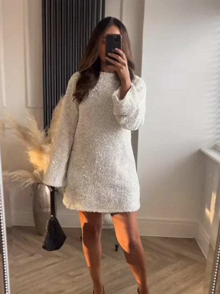 Dazzling women's sequin dress, knee-length, with an eye-catching back bow for special occasions.