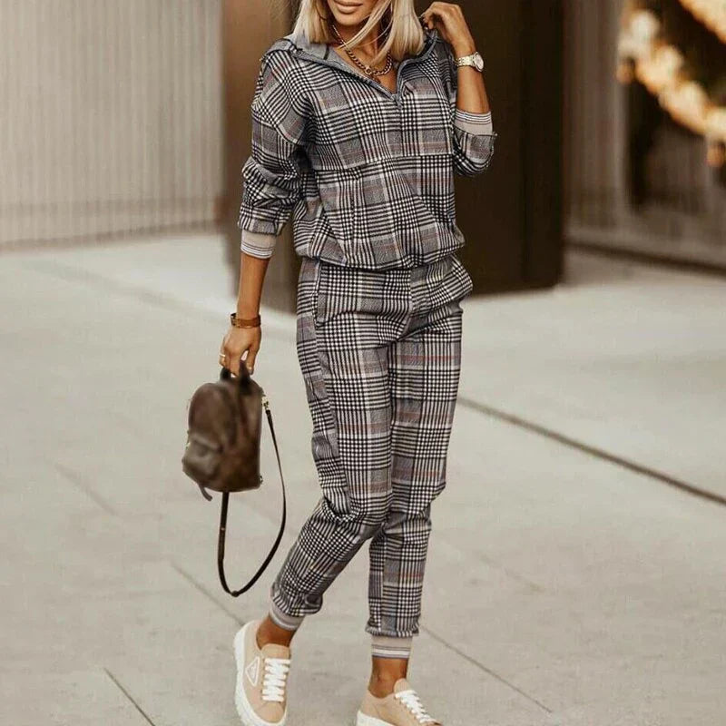 Fashionable women's tracksuit. This modern casual two-piece set with a zipper top is great for activewear.
