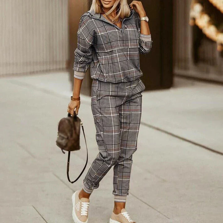Fashionable women's tracksuit. This modern casual two-piece set with a zipper top is great for activewear.