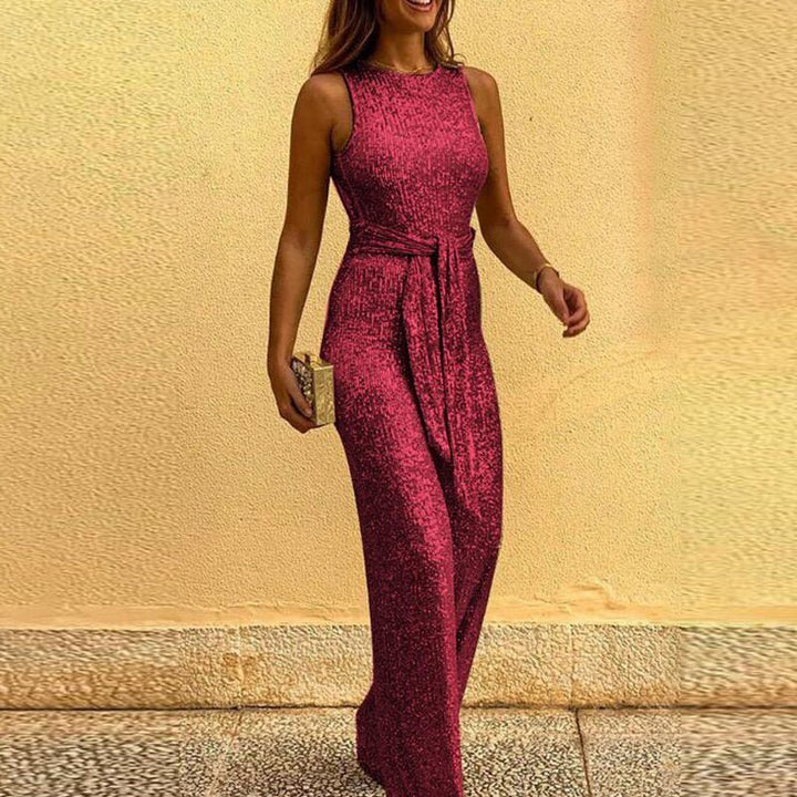 Chic women's sequin wide-leg jumpsuit featuring a sparkling shimmer and stylish waist tie for fashion-forward events.