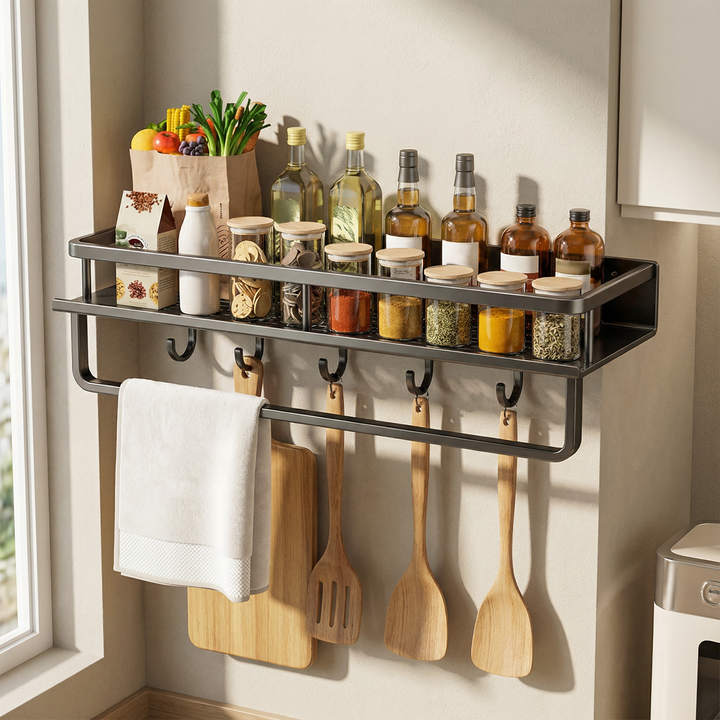 Space-saving gray metal kitchen shelf with utility hooks, offering efficient wall storage for a neat kitchen.