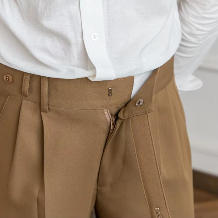 Elegant menswear pleated chinos, tailored fit for sophisticated casual & formal looks.
