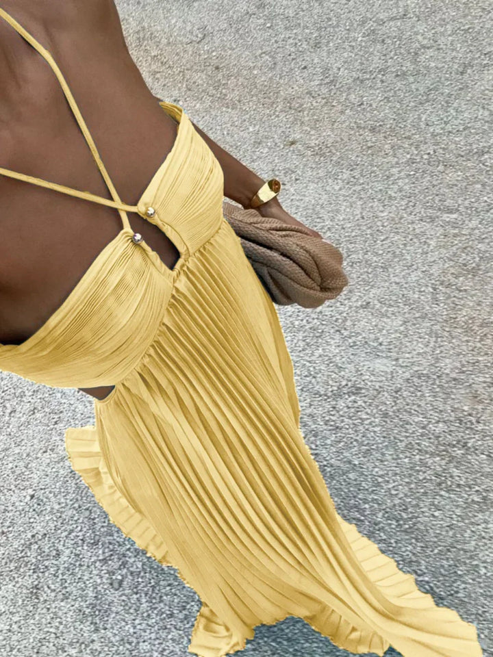 Elegant women's pleated halter neck maxi dress with high-waisted side cut-out design, perfect for evening wear.