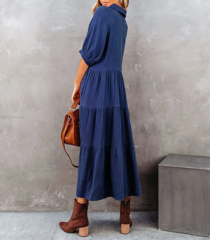Elegant women's midi summer dress, comfortable and versatile for warm weather, features convenient pockets.