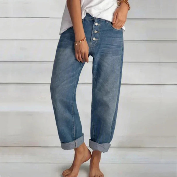 Comfortable women's loose-fit high-waist blue denim jeans, perfect for a chic everyday look.