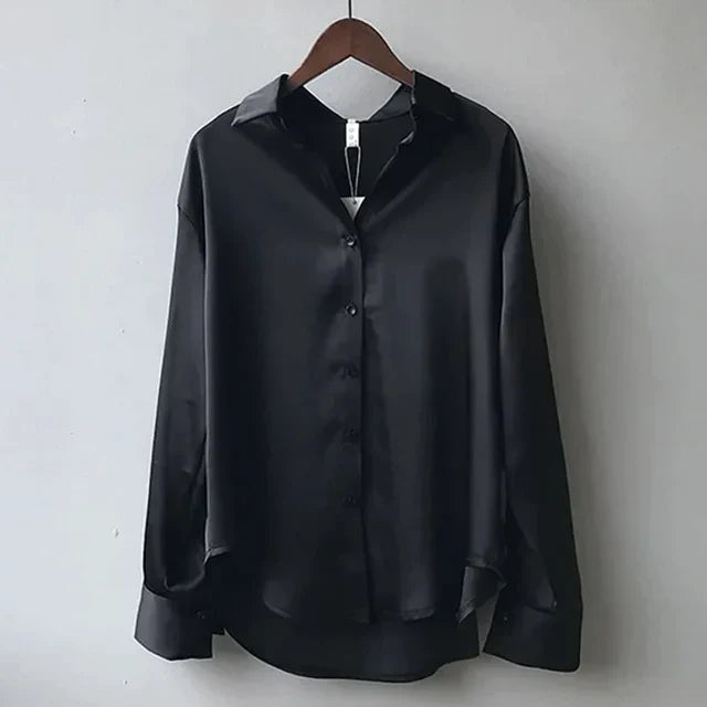 Effortless style with this women's modern long-sleeve button-down shirt. A chic and comfortable blouse for versatile wear.