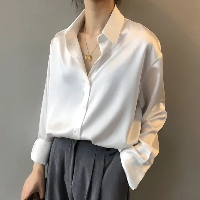 Versatile women's long-sleeve button-down blouse. A modern design ideal for workwear, office fashion, or casual tops.