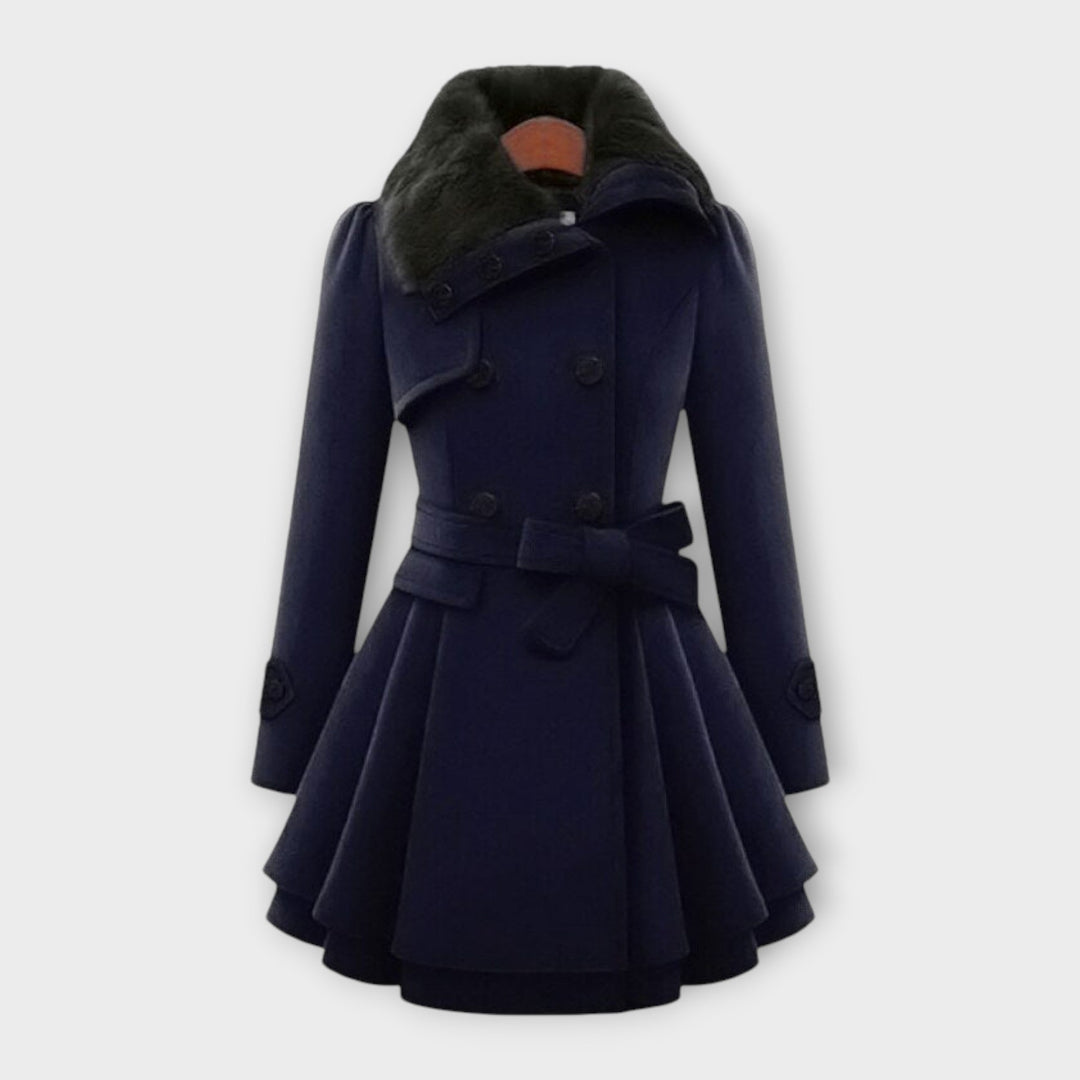 Stylish women's elegant winter coat. Double-breasted long jacket with a cozy faux fur collar, ideal for fall fashion.
