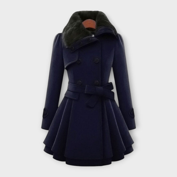 Stylish women's elegant winter coat. Double-breasted long jacket with a cozy faux fur collar, ideal for fall fashion.