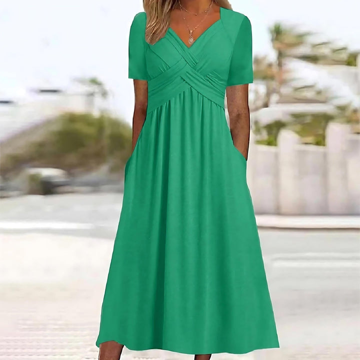 Elegant women's midi dress, flattering design with comfortable belly coverage for all-day wear.