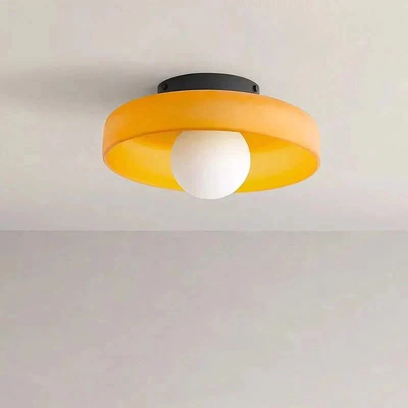 Close-up of elegant clear glass shade on a Scandinavian ceiling lamp, modern design.