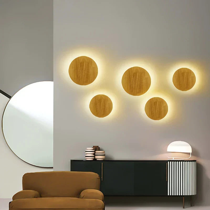 Natural wood wall lamp provides warm ambient light, ideal for Scandinavian bedroom or living room accent.