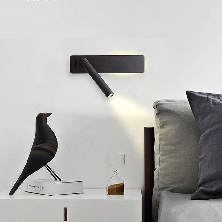 Minimalist LED wall light for bedroom. Adjustable arm delivers focused, comfortable illumination for reading in bed.