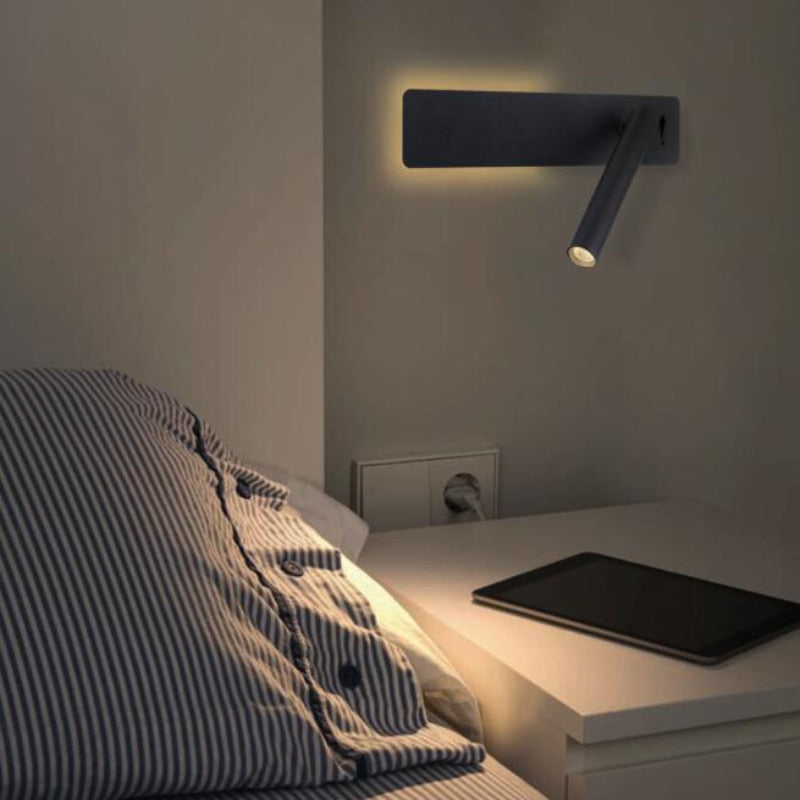 Contemporary adjustable LED wall reading lamp. Perfect as a bedside light, offers focused illumination for any task.
