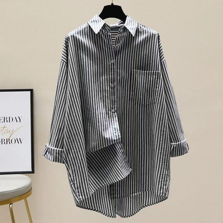 Essential women's striped oversized casual shirt, boasting a longer back and classic chest pocket.