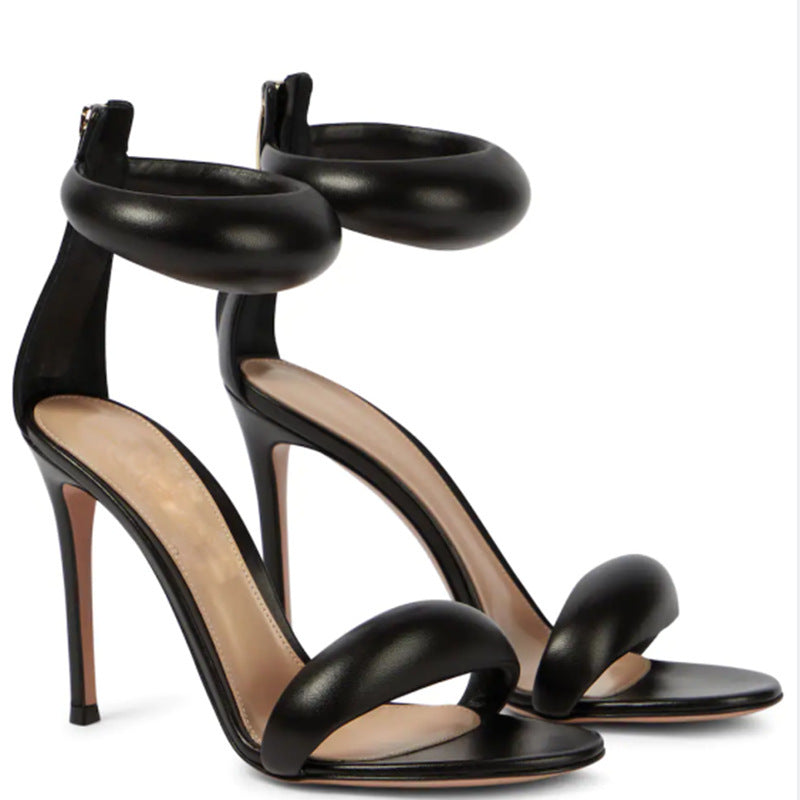 Glamorous women's party heels, featuring delicate strappy design and a slender high heel ankle strap.