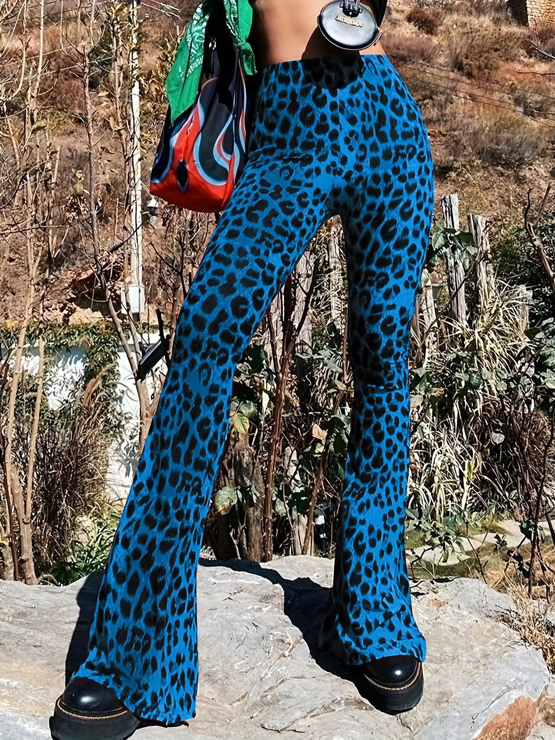 Comfortable elastic waistband on women's trendy leopard print flared leggings, chic casual bottoms.