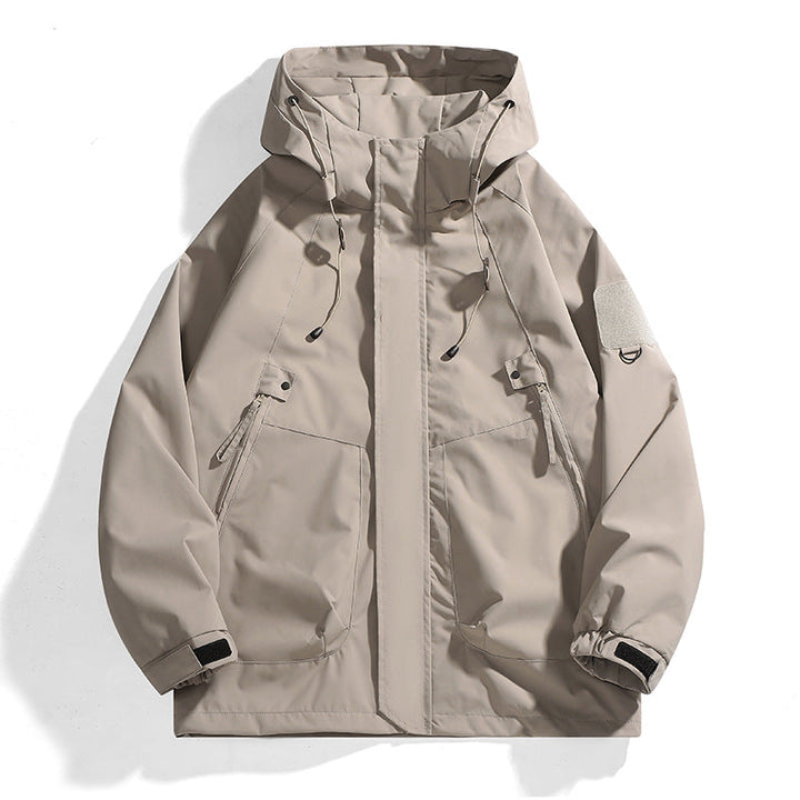 Essential women's adventure gear: a waterproof outdoor jacket with an adjustable hood for diverse weather.