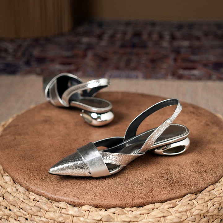 Stylish silver metallic slingback heels for women, pointed toe design, perfect for parties and events.