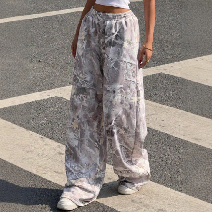 Model wearing comfortable women's printed wide leg pants with elastic waist, ideal for casual summer style.