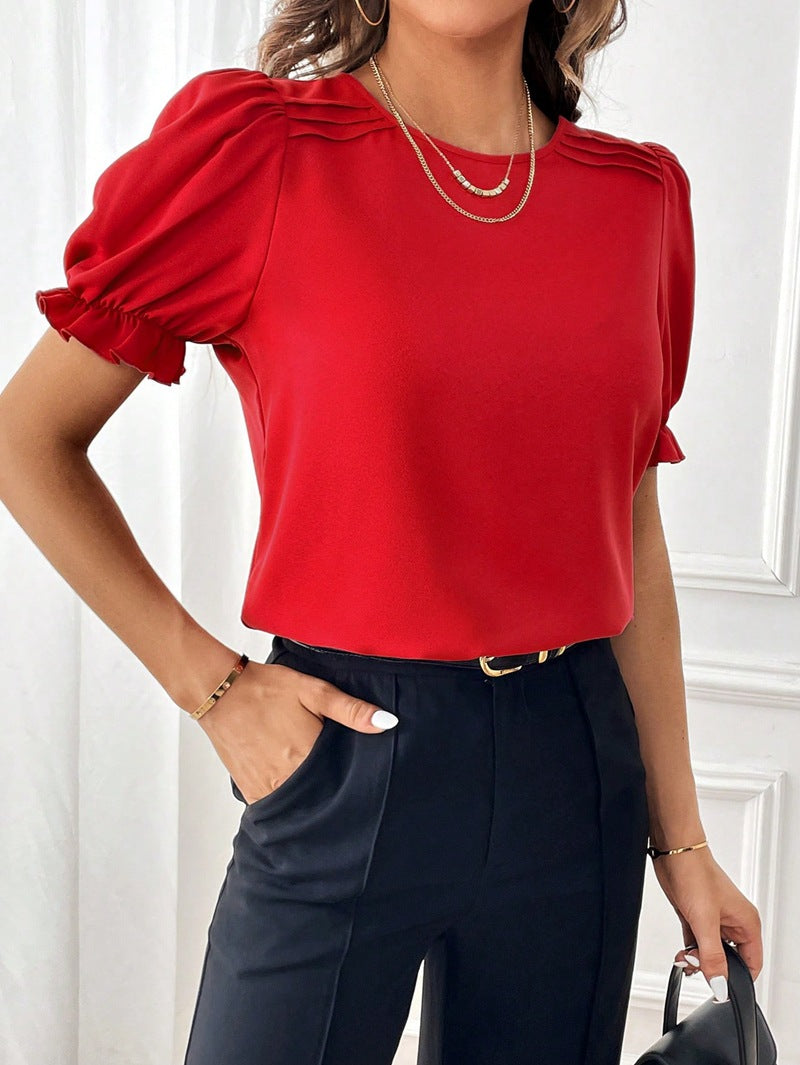 Clean design women's short sleeve round neck blouse, perfect for a polished casual look.