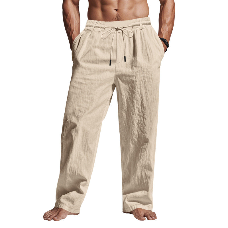 Comfortable men's relaxed fit trousers with drawstring waist. Breathable full length pants for versatile casual style.