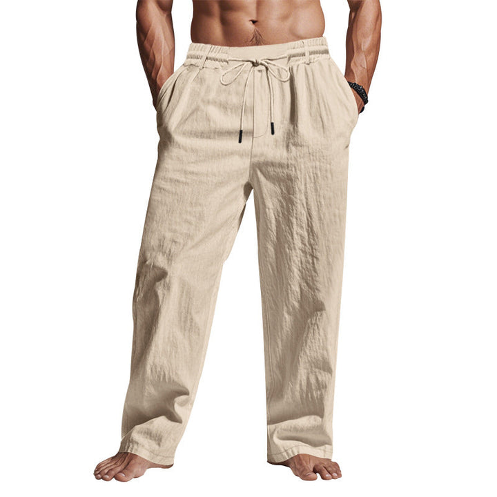 Comfortable men's relaxed fit trousers with drawstring waist. Breathable full length pants for versatile casual style.
