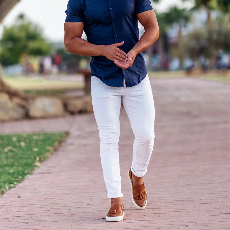 Front view: Stylish men's slim-fit chinos in modern grey, ideal for office or smart-casual spring outfits.