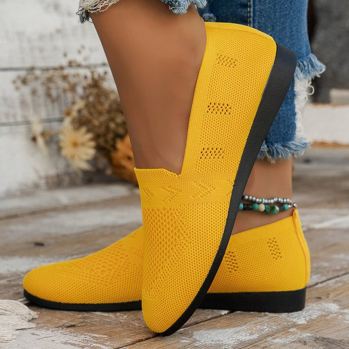 Elegant ladies' breathable comfort slippers, showcasing stylish design and soft material for indoor wear.
