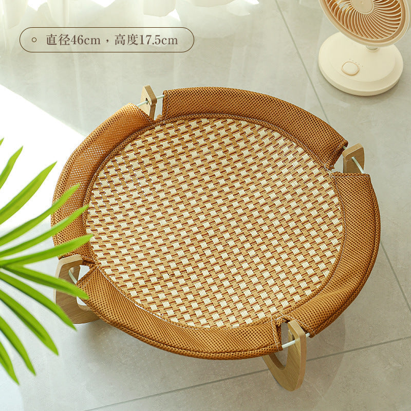 Comfortable cooling rattan cat bed, perfect for summer pet relaxation. Keeps cats cool on hot days.