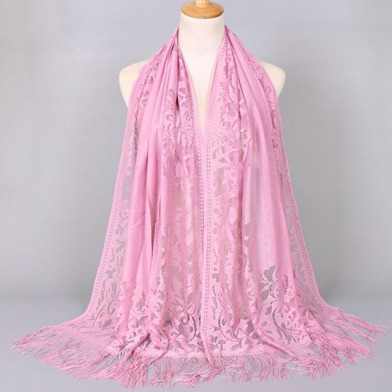 Stylish women's fringed lace scarf, with intricate floral design, a charming fashion accessory.