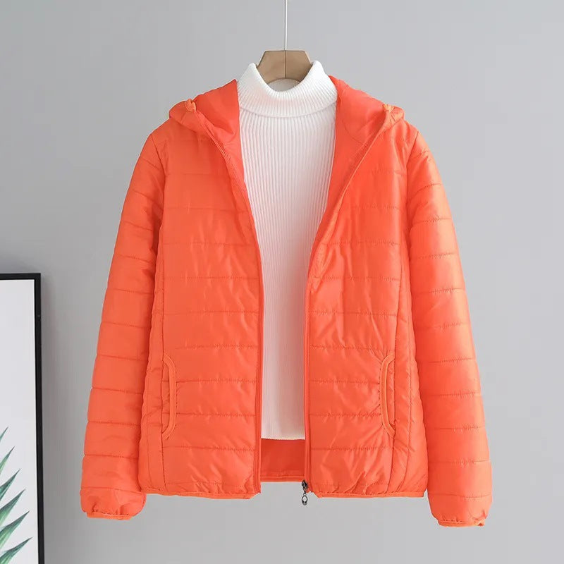 Back view of a ladies lightweight quilted jacket, showing hood & flattering fit.