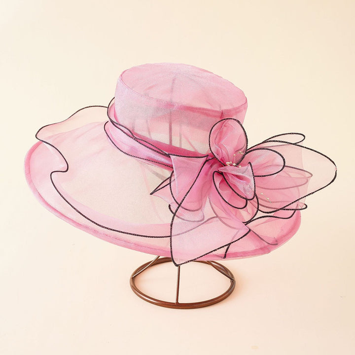 Summer-ready elegant mesh sun hat for women, featuring a beautiful romantic bow and wide brim.