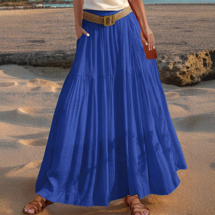 Women's versatile pleated maxi skirt with pockets, offering effortless style and comfort.