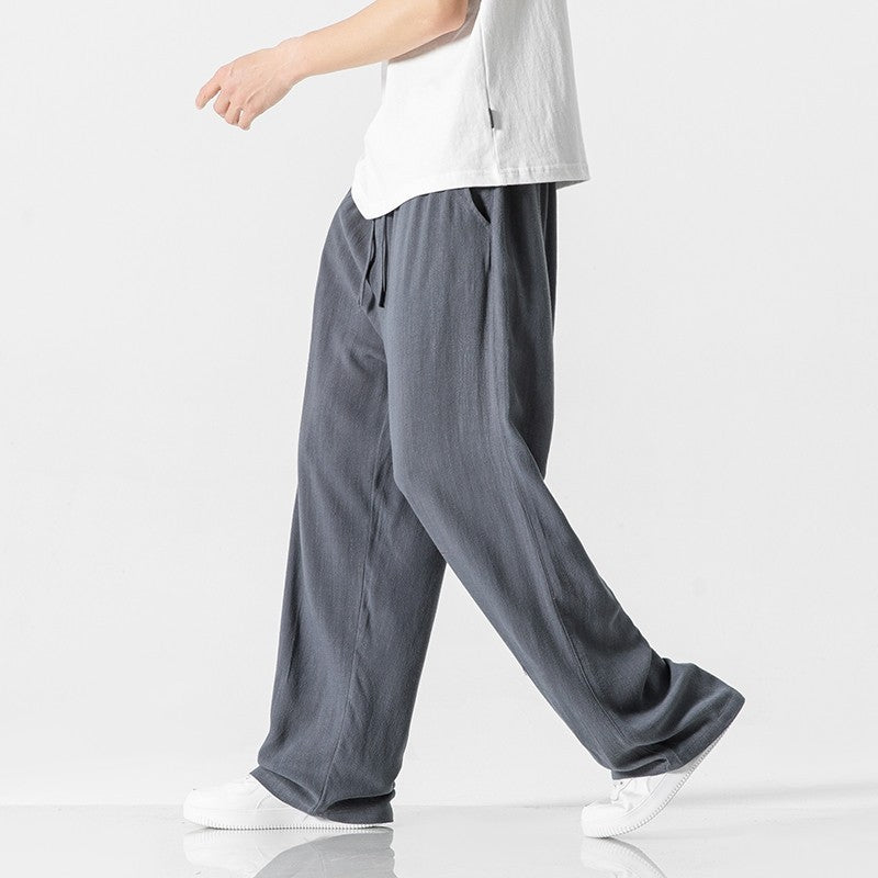 Full-length men's casual pants, loose fit with a practical drawstring waist for comfort.