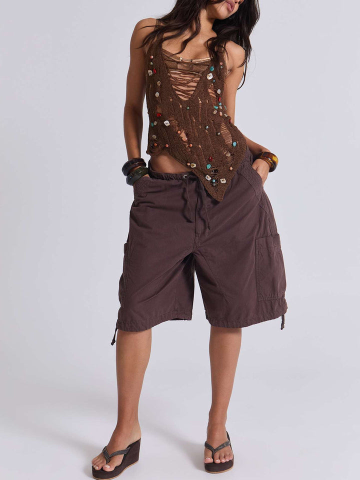 Fashionable women's utility shorts, featuring a comfortable relaxed fit and functional cargo pockets for essentials.